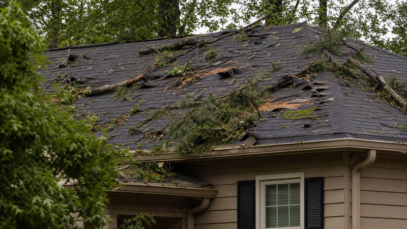 Hail and wind damage on a residential roof in Atlanta, GA
